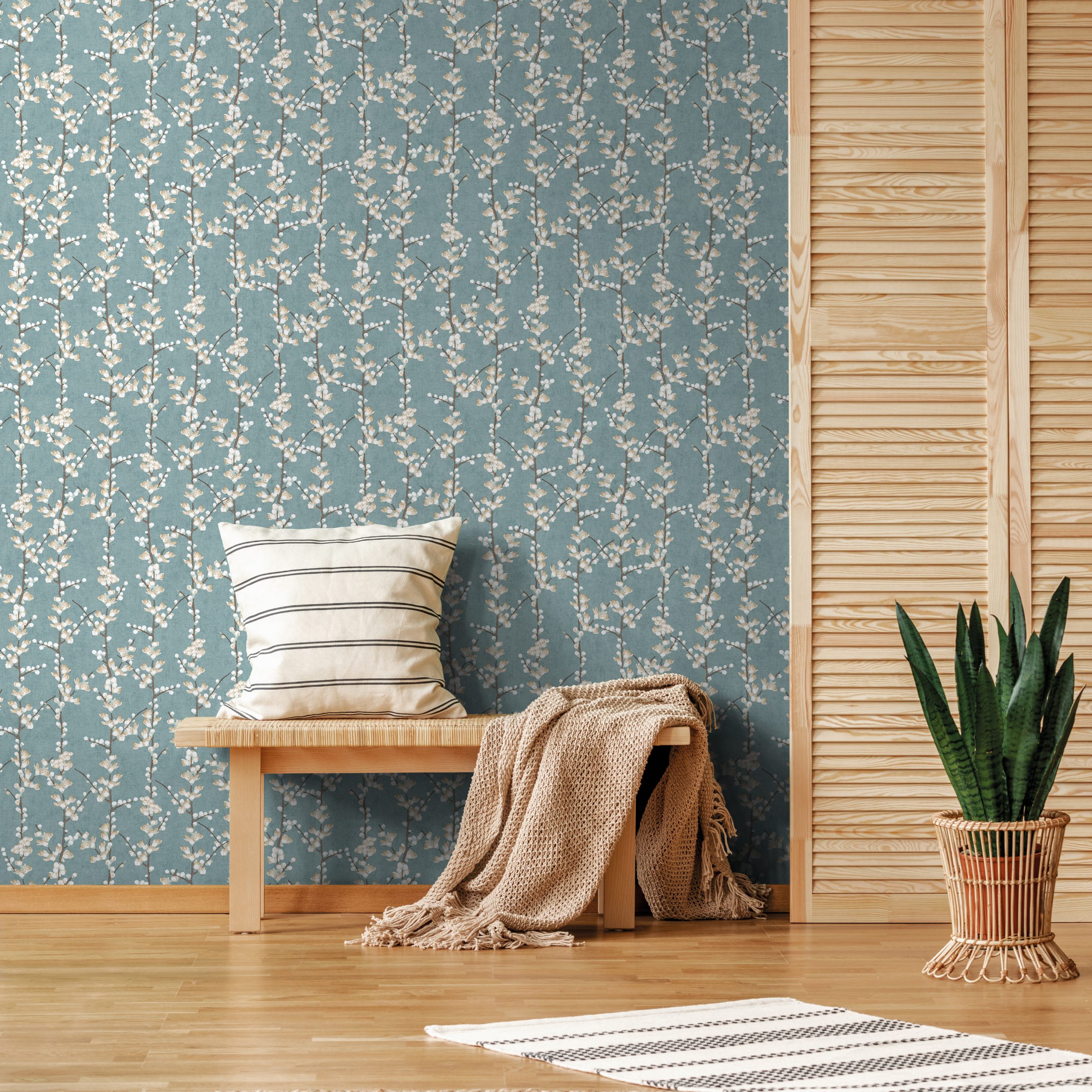 Rug,And,Plant,Near,Wooden,Stool,With,Pillow,And,Blanket